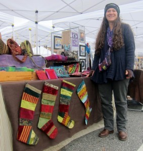Hyattsville textile artist Rebecca Williams displays her Christmas stockings and other fabric art at Handmade on Hamilton. Photo courtesy Susie Currie (November 2012).
