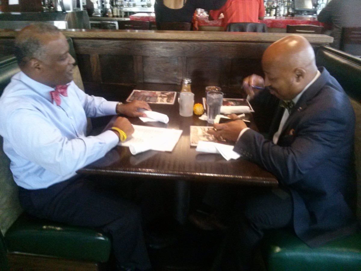 County Executive Rushern Baker, III (left) met with colleagues last week, including Calvin Hawkins, Jr. (right) at Busboys and Poets in Hyattsville.  Photo courtesy Rebecca Bennett.