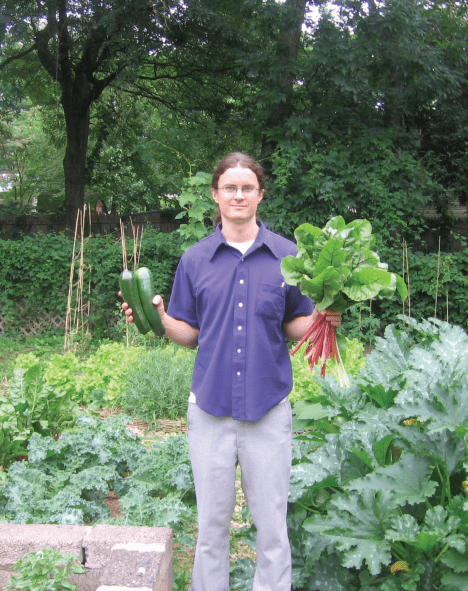 Joe Ludes with some of last summer’s bounty from his double-lot garden  on 44th Avenue. Photo by Jeannette Soon-Ludes.