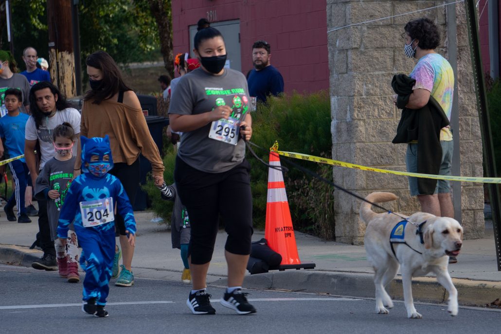 Police dog joins the run.