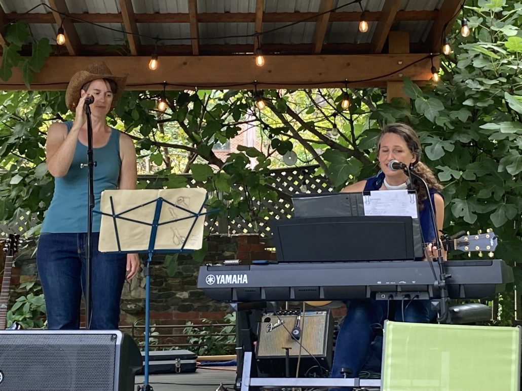 Audrey Engdahl and Jessica Arends sing Americana Favorites at Porchfest 2022. 
Photo courtesy of Andrei Isreal