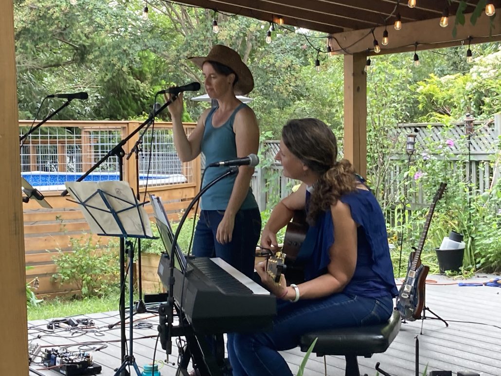 Audrey Engdahl and Jessica Arends sing Americana Favorites at Porchfest 2022. 
Photo courtesy of Andrei Isreal