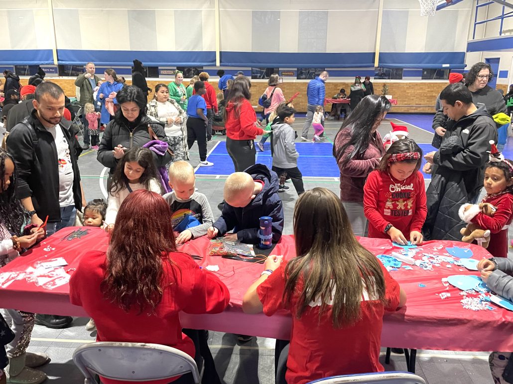 Children enjoy arts and crafts activities in the Laurel Armory gymnasium before the outdoor lighting ceremony.
Photo Credit: Aiesha Solomon